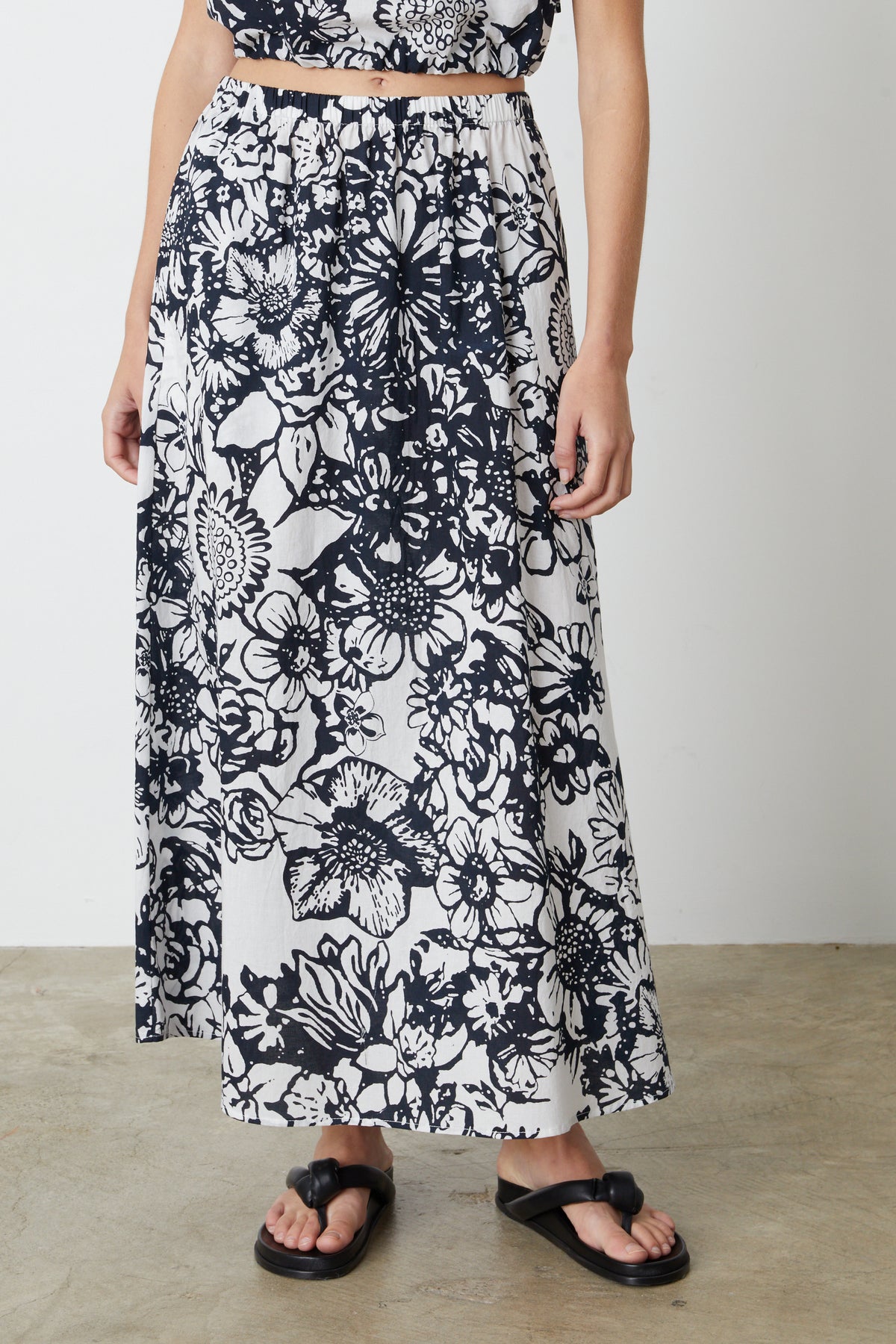 A woman wearing a Velvet by Graham & Spencer Juliana Printed Maxi Skirt.-26793045721281