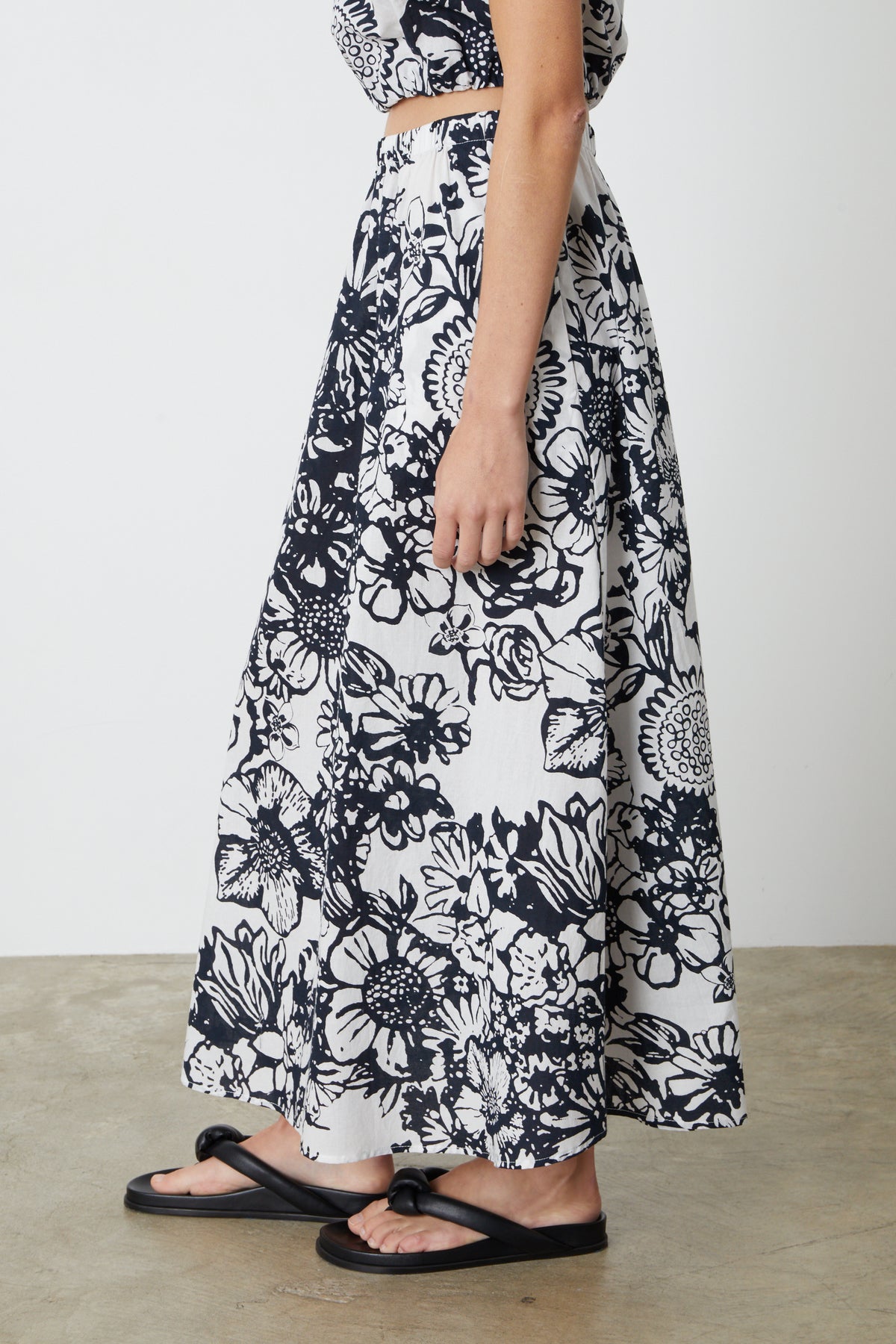   The model is wearing a Velvet by Graham & Spencer Juliana printed maxi skirt. 