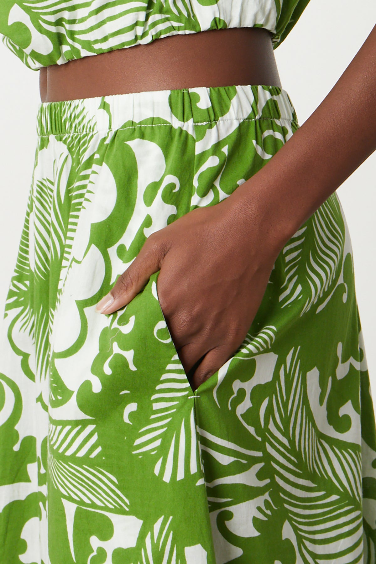 a woman wearing a Velvet by Graham & Spencer JULIANA PRINTED MAXI SKIRT.-26342702252225