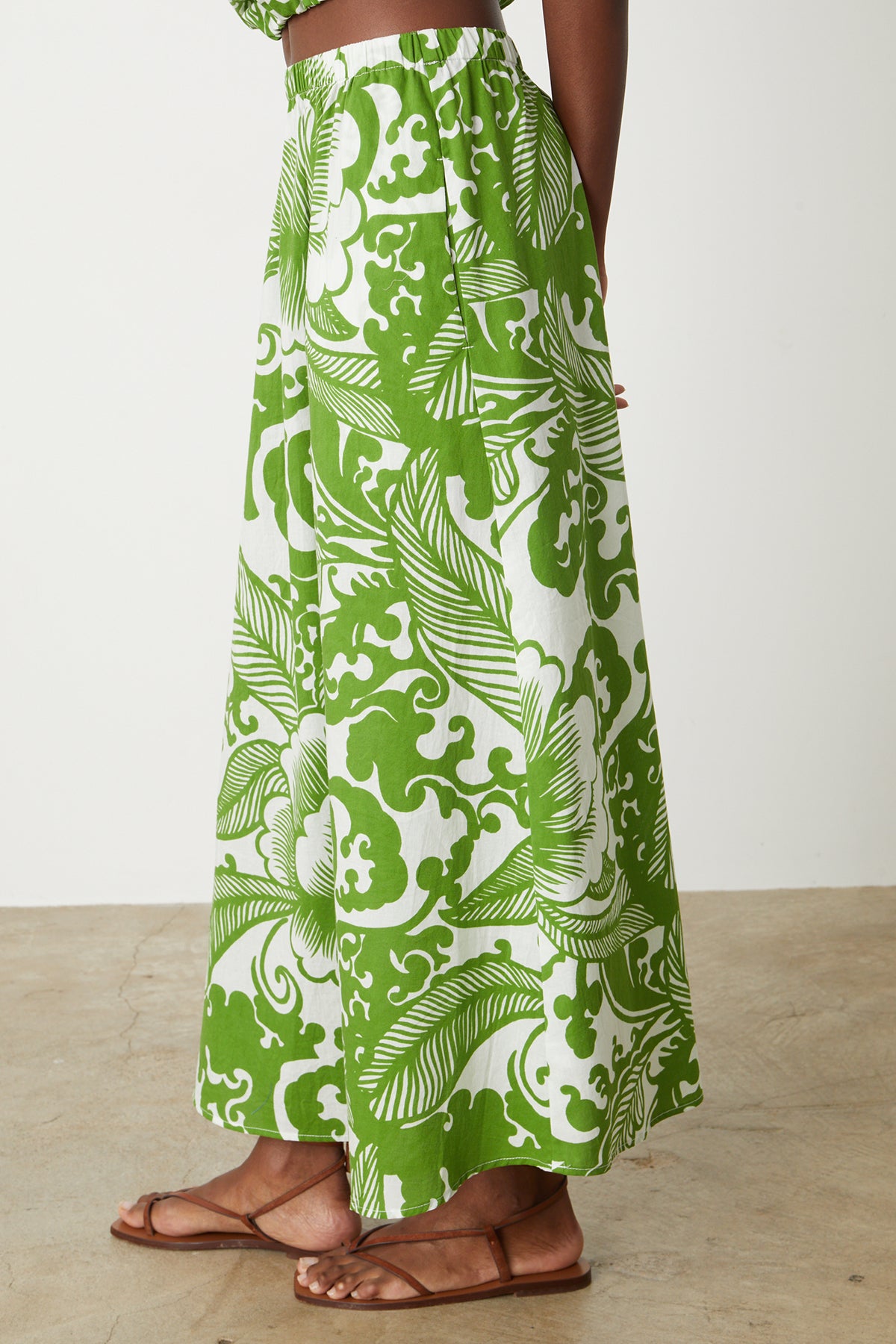   a woman wearing a Velvet by Graham & Spencer Juliana Printed Maxi Skirt. 