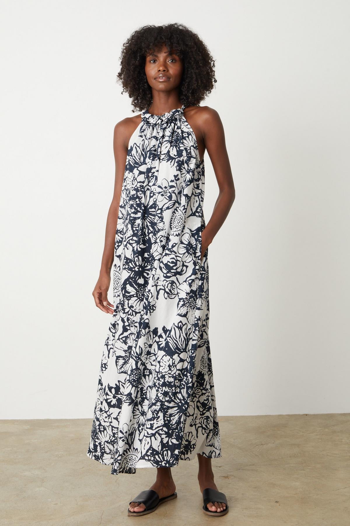 A woman wearing the Velvet by Graham & Spencer Penelope Printed Maxi Dress.-26757320769729