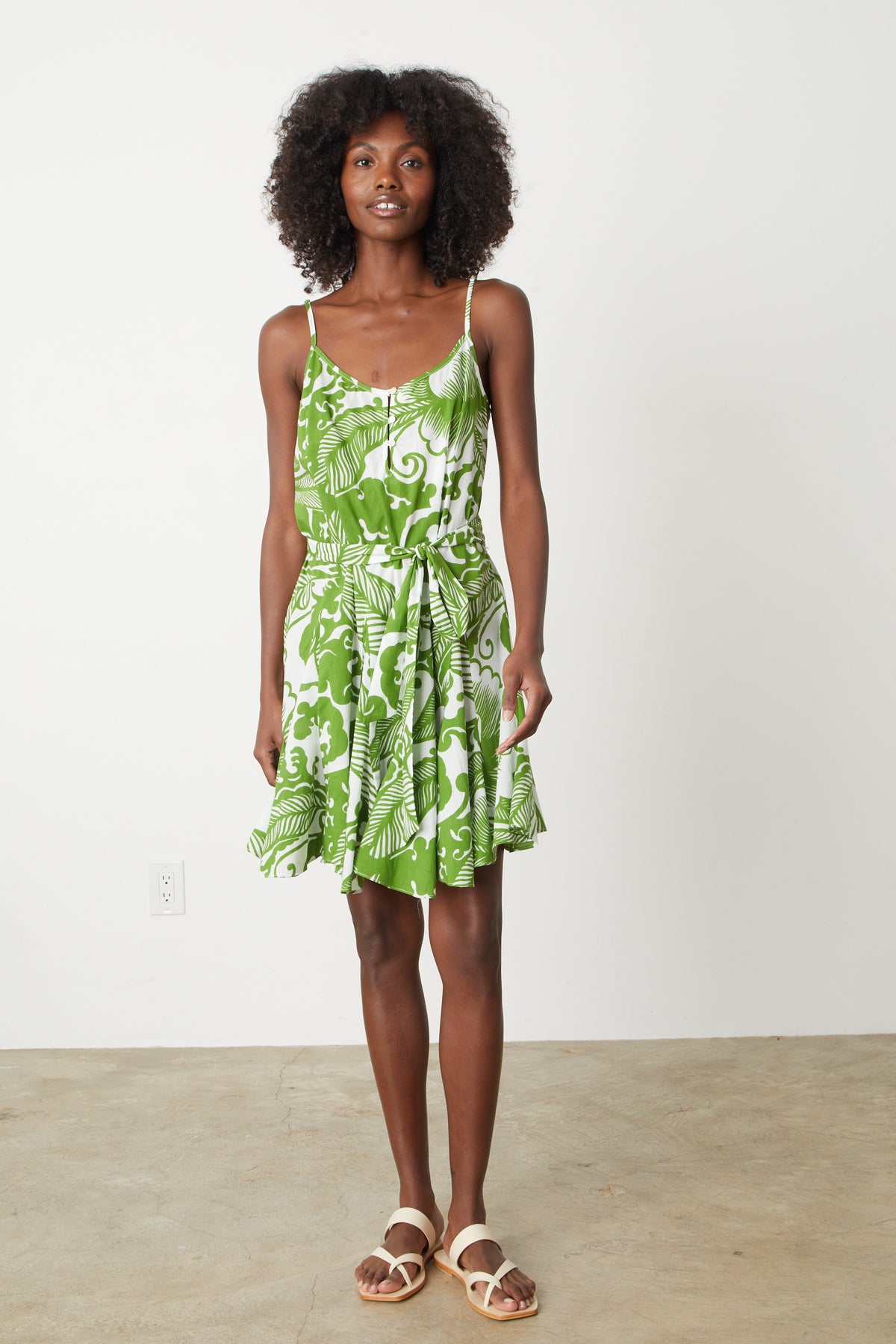 A woman wearing the Velvet by Graham & Spencer VIVIAN PRINTED DRESS, a floral print dress.-26774913450177
