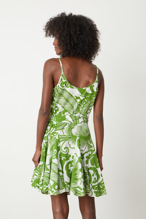 The back view of a woman wearing a Velvet by Graham & Spencer VIVIAN PRINTED DRESS.