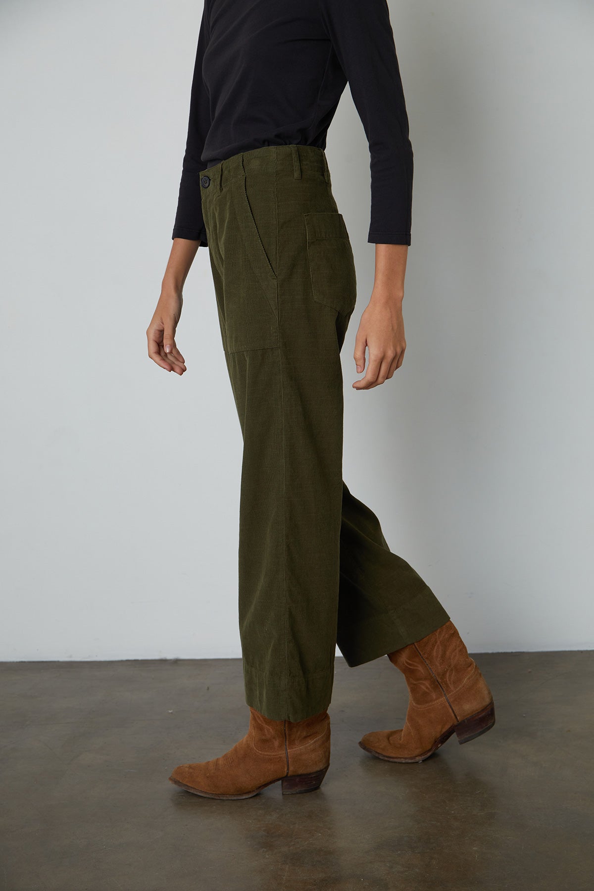   Vera Corduroy Wide Leg Pant in Aloe side pocket standing with boots 