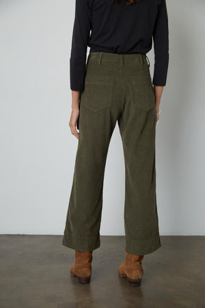 The back view of a woman wearing Velvet by Graham & Spencer's VERA CORDUROY WIDE LEG PANT.