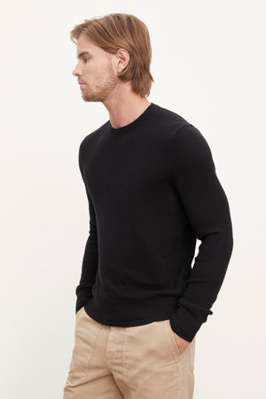 A man wearing a Velvet by Graham & Spencer ACE THERMAL CREW.