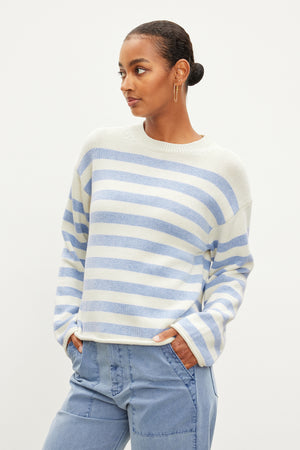 The model is wearing a Velvet by Graham & Spencer LEX STRIPED CREW NECK SWEATER.