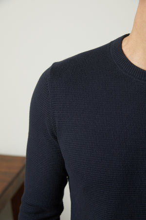 The back view of a man wearing a Velvet by Graham & Spencer WALTER CREW NECK SWEATER.