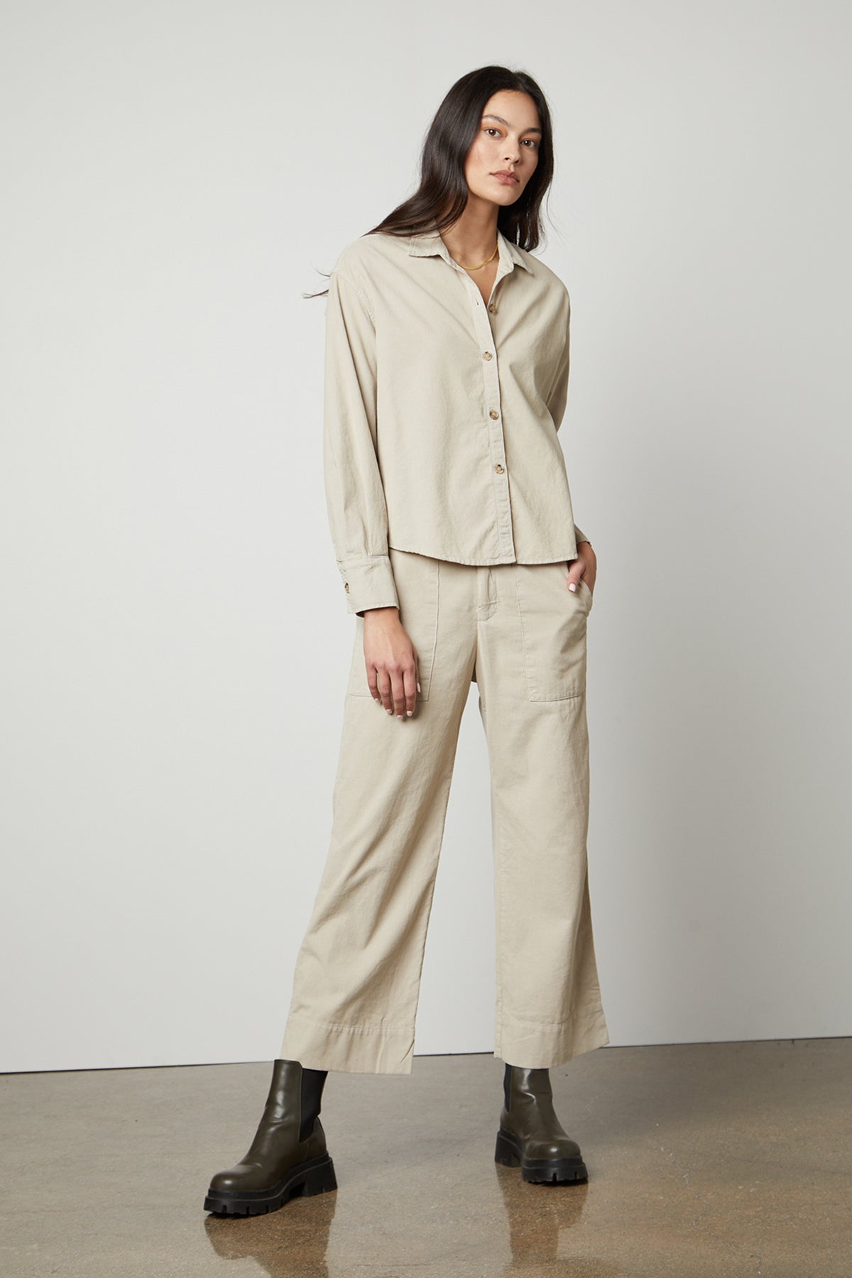   The model is wearing a beige VERA CORDUROY WIDE LEG PANT by Velvet by Graham & Spencer. 
