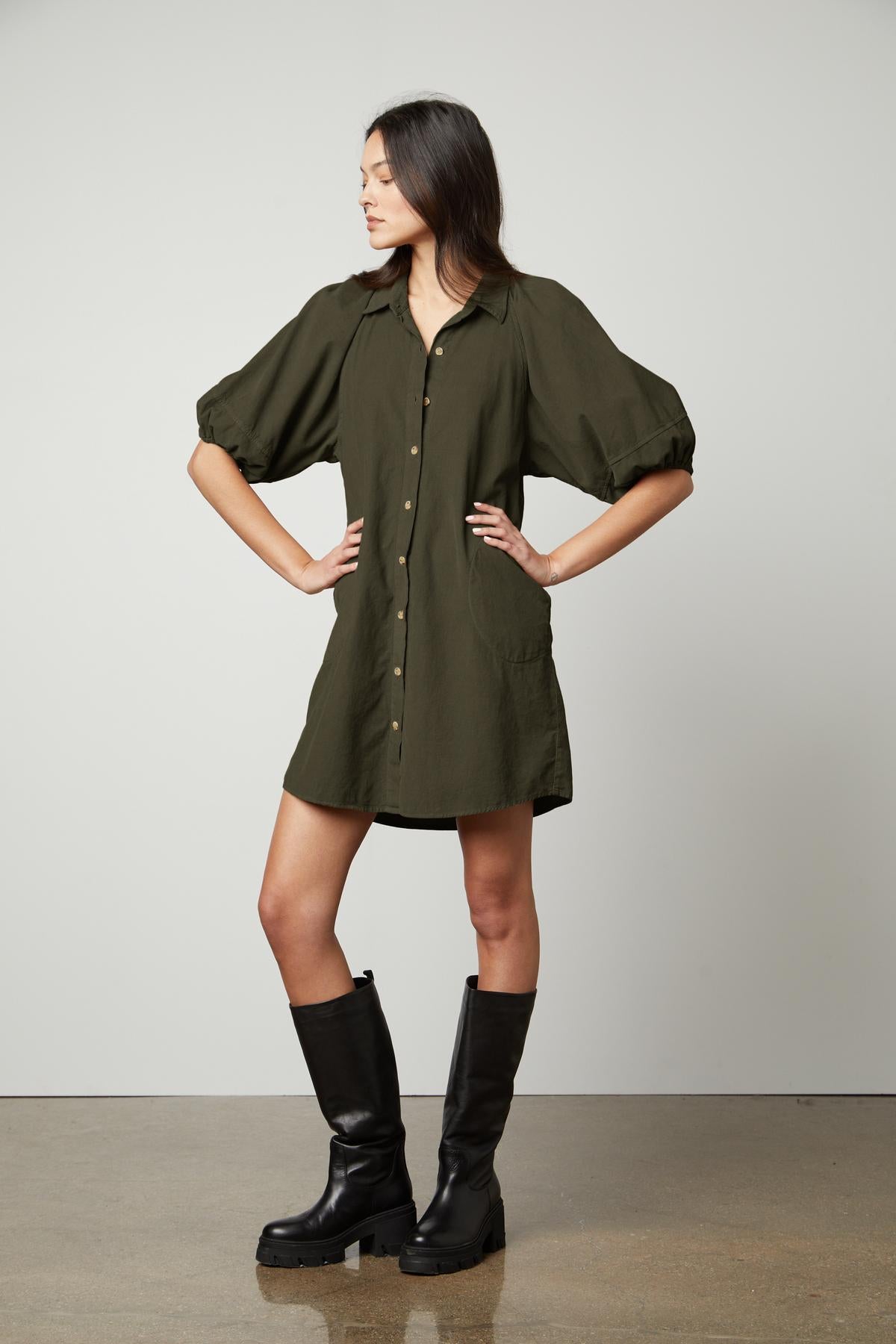   The model is wearing a KADY CORDUROY BUTTON-UP DRESS by Velvet by Graham & Spencer, perfect for everyday wear. 