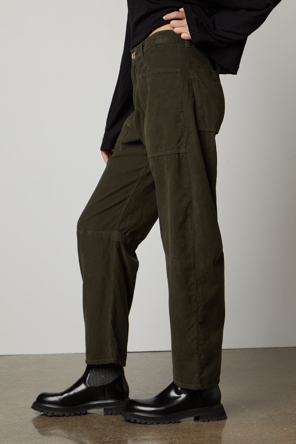 The model is wearing a black top and Velvet by Graham & Spencer's SUE CORDUROY PANT.-26799933391041