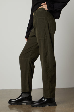 The model is wearing a black top and Velvet by Graham & Spencer's SUE CORDUROY PANT.