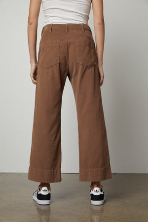 The back view of a woman wearing Velvet by Graham & Spencer's VERA CORDUROY WIDE LEG PANT with utility details.