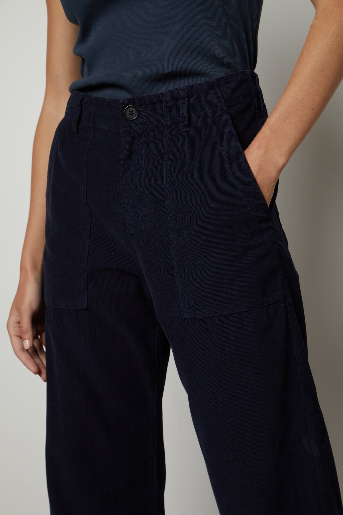 A woman wearing a Velvet by Graham & Spencer VERA CORDUROY WIDE LEG PANT with pockets.-26727714259137