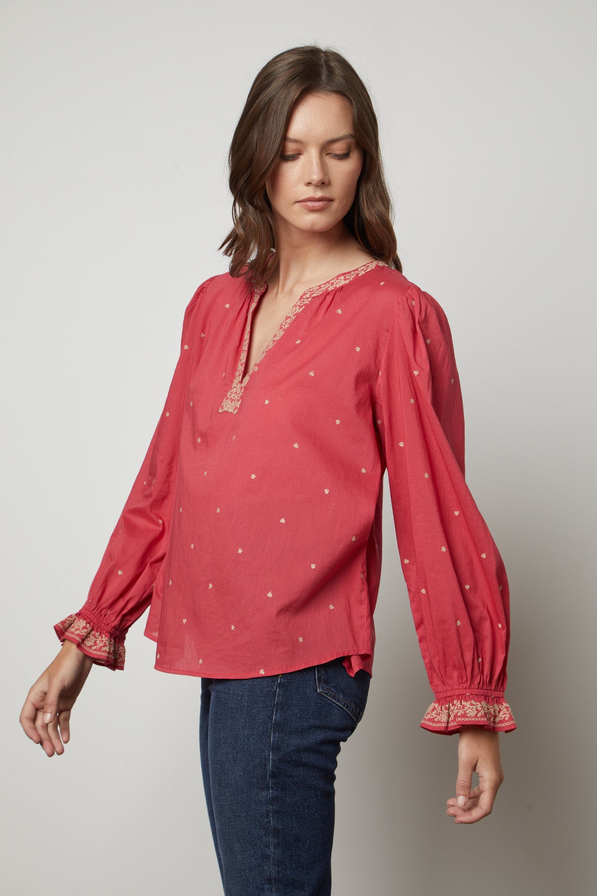   The model is wearing an ANIA EMBROIDERED BOHO TOP by Velvet by Graham & Spencer, giving it a boho vibe. 