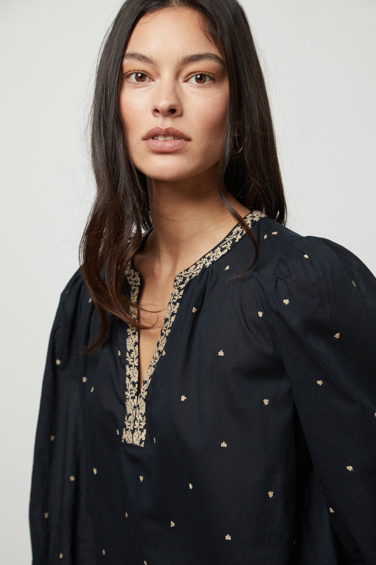 The model is wearing a "ANIA EMBROIDERED BOHO TOP" by Velvet by Graham & Spencer.-26727642529985