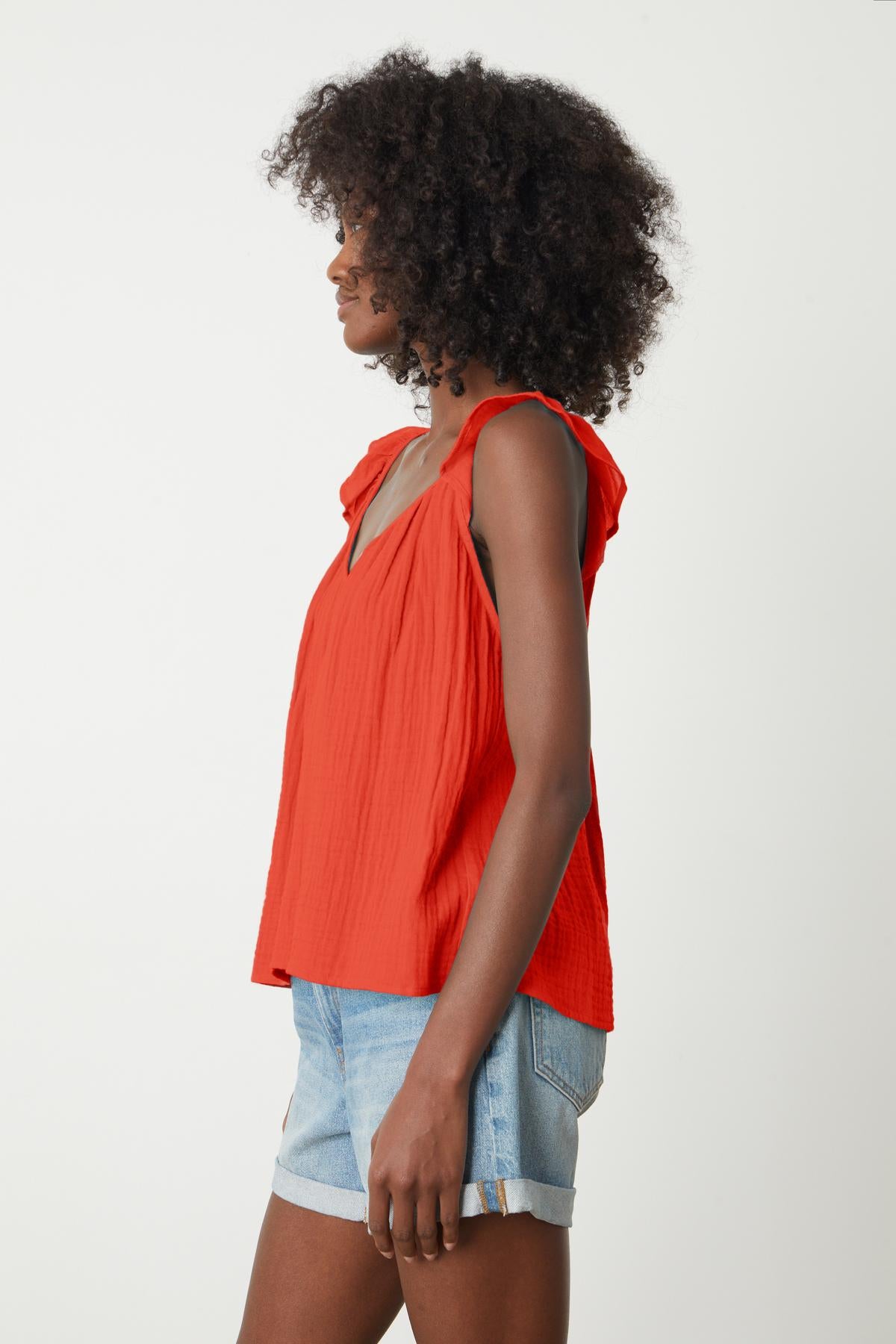   The view of a woman wearing an ANETTE COTTON GAUZE TOP from Velvet by Graham & Spencer and shorts. 