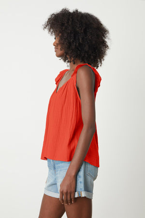 The view of a woman wearing an ANETTE COTTON GAUZE TOP from Velvet by Graham & Spencer and shorts.