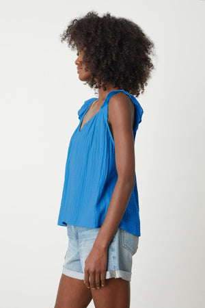 The view of a woman wearing a Velvet by Graham & Spencer ANETTE COTTON GAUZE TOP and shorts from the back.