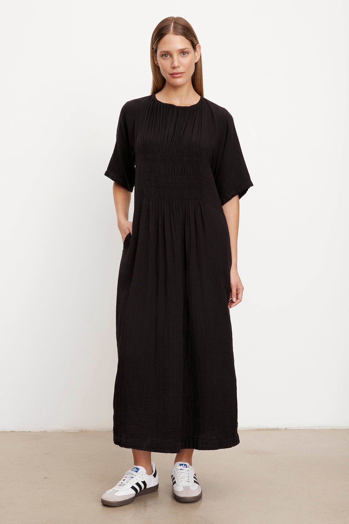   A woman wearing the ASHLEIGH COTTON GAUZE MAXI DRESS by Velvet by Graham & Spencer. 