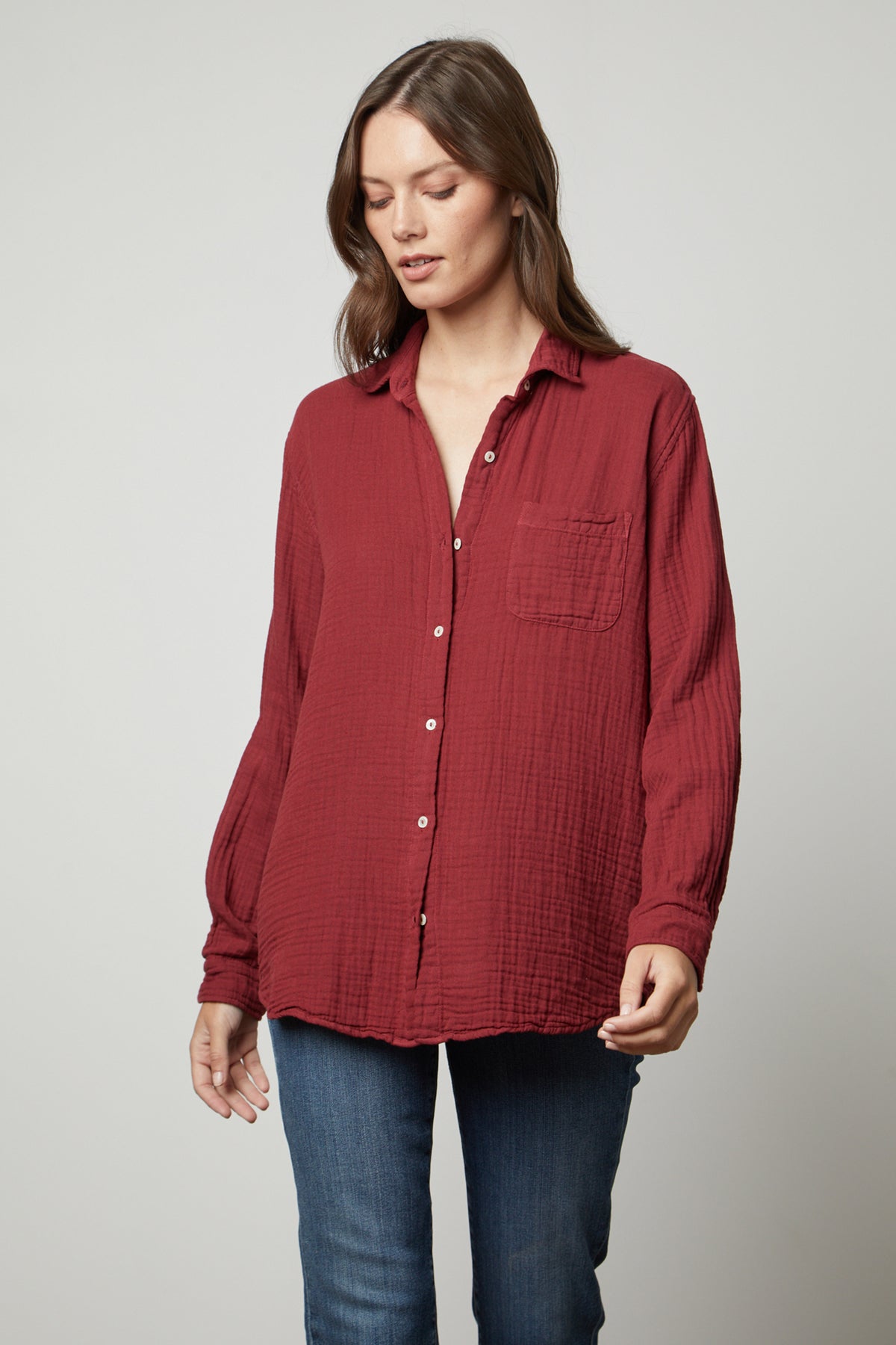 The model is wearing an oversized fit MARGO COTTON GAUZE BUTTON-UP SHIRT by Velvet by Graham & Spencer.-35655728332993