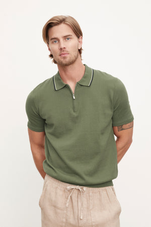 A man in an OTTO ZIP POLO by Velvet by Graham & Spencer.