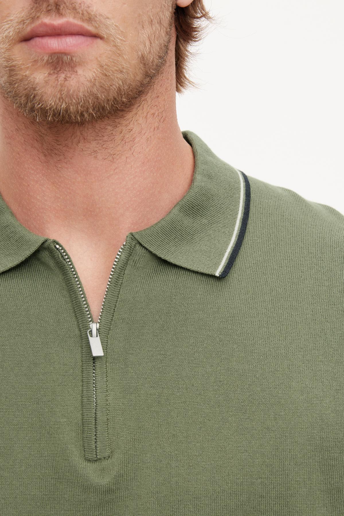   A close up of a man's neck wearing the Velvet by Graham & Spencer OTTO ZIP POLO. 