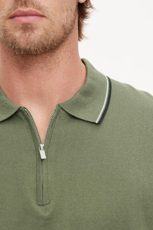 A close up of a man's neck wearing the Velvet by Graham & Spencer OTTO ZIP POLO.