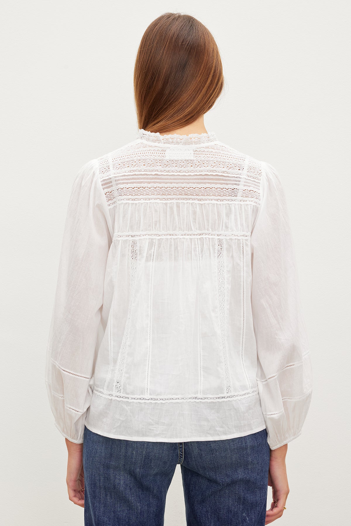   The back view of a woman wearing a Velvet by Graham & Spencer LIAM COTTON LACE BUTTON FRONT TOP. 