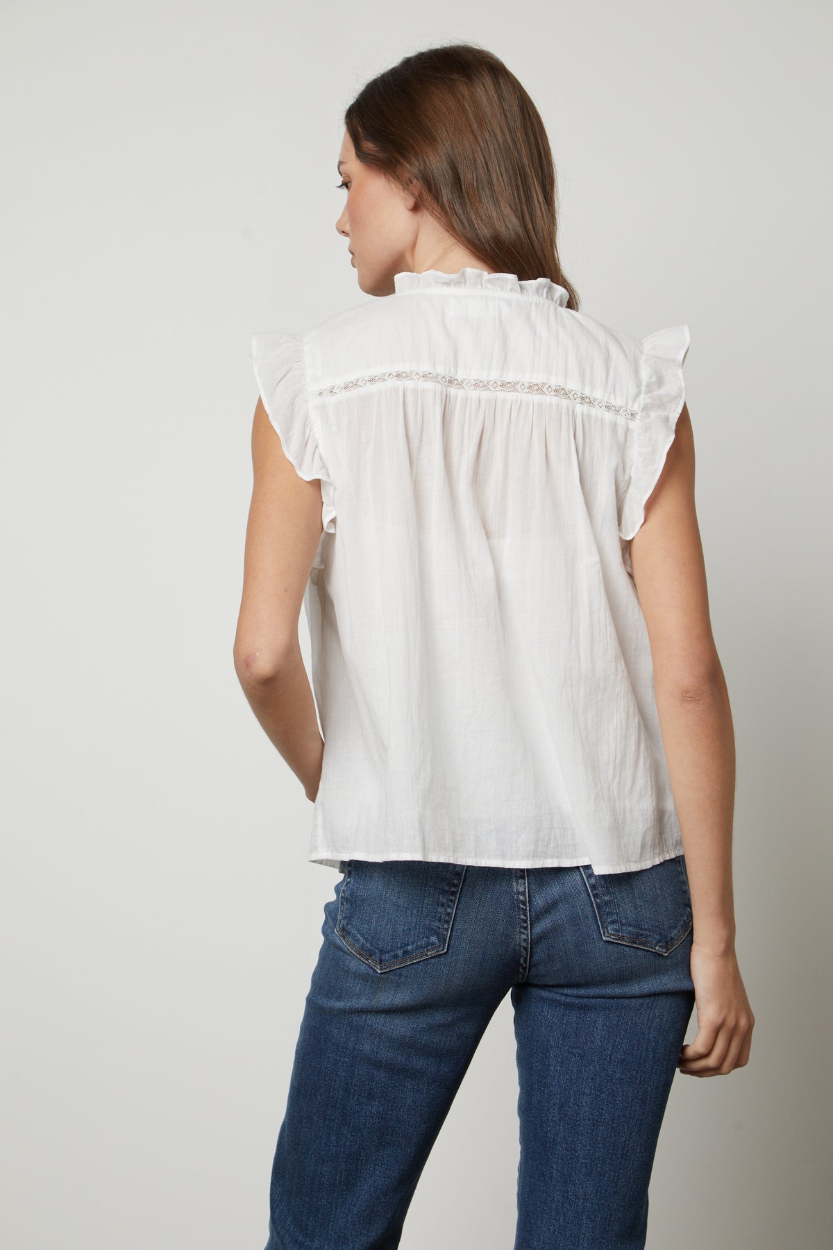 The back view of a woman wearing a LIANA LACE TANK TOP from Velvet by Graham & Spencer with cotton lace detailing.-35656122663105