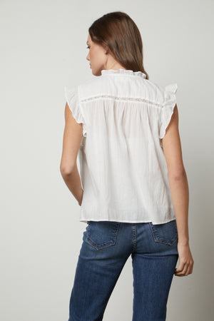 The back view of a woman wearing a LIANA LACE TANK TOP from Velvet by Graham & Spencer with cotton lace detailing.