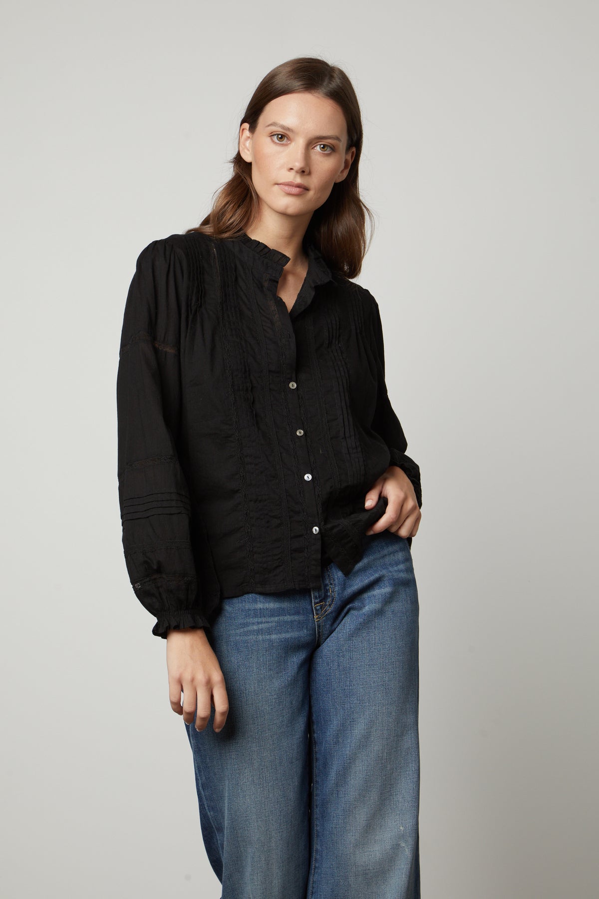 The model is wearing a ROMY LACE BOHO TOP blouse and jeans. (Brand: Velvet by Graham & Spencer)-26834995642561