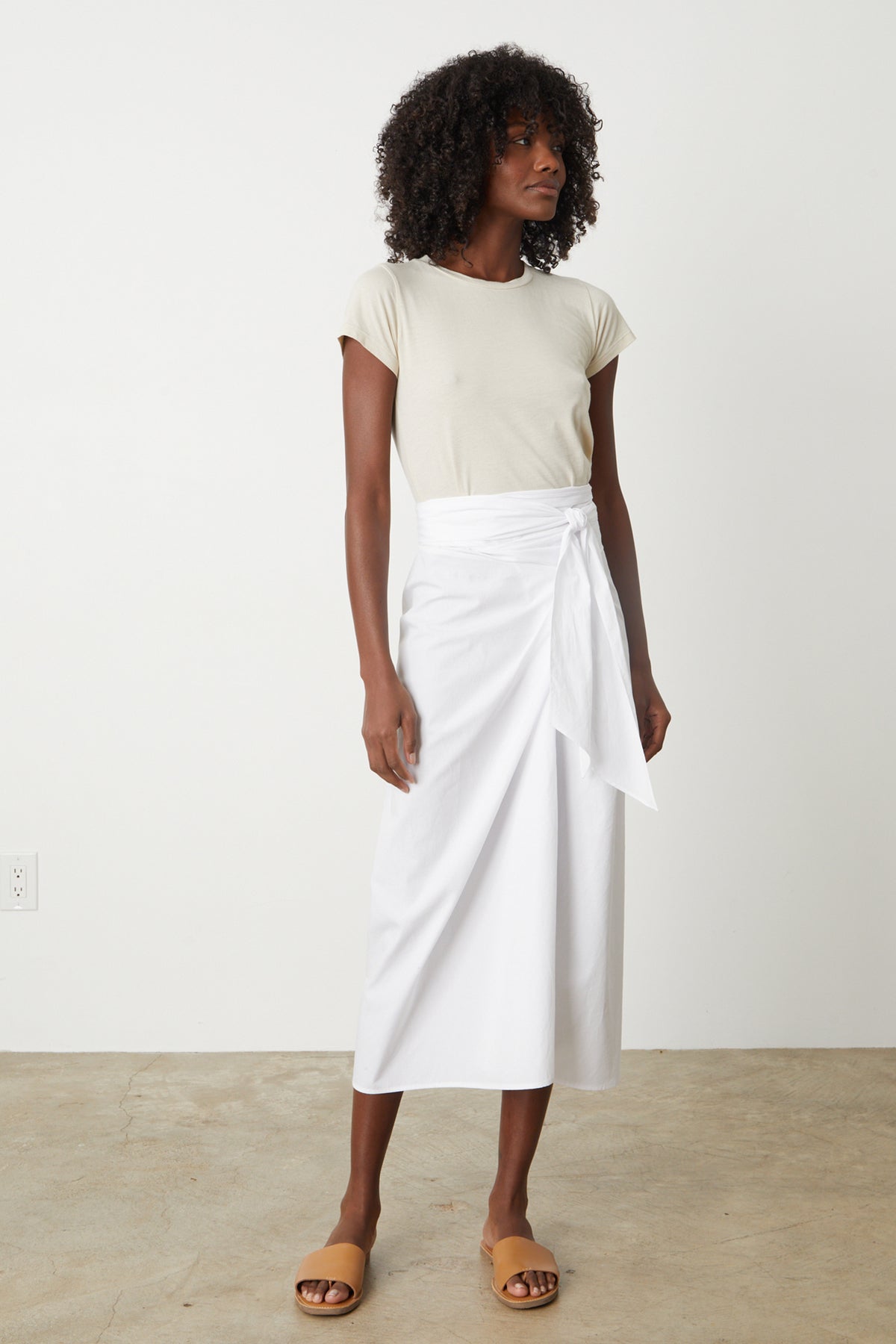Leena Skirt with tie in front white with Nina Tee in bisque tucked, full length front with slides-26479442428097