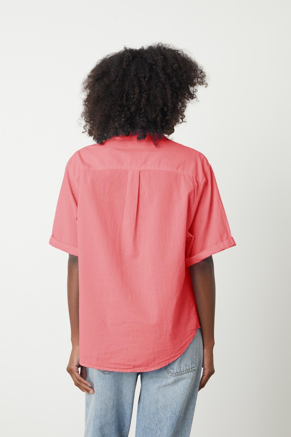 The back view of a woman wearing a Velvet by Graham & Spencer SHANNON BUTTON-UP SHIRT.-26801046749377