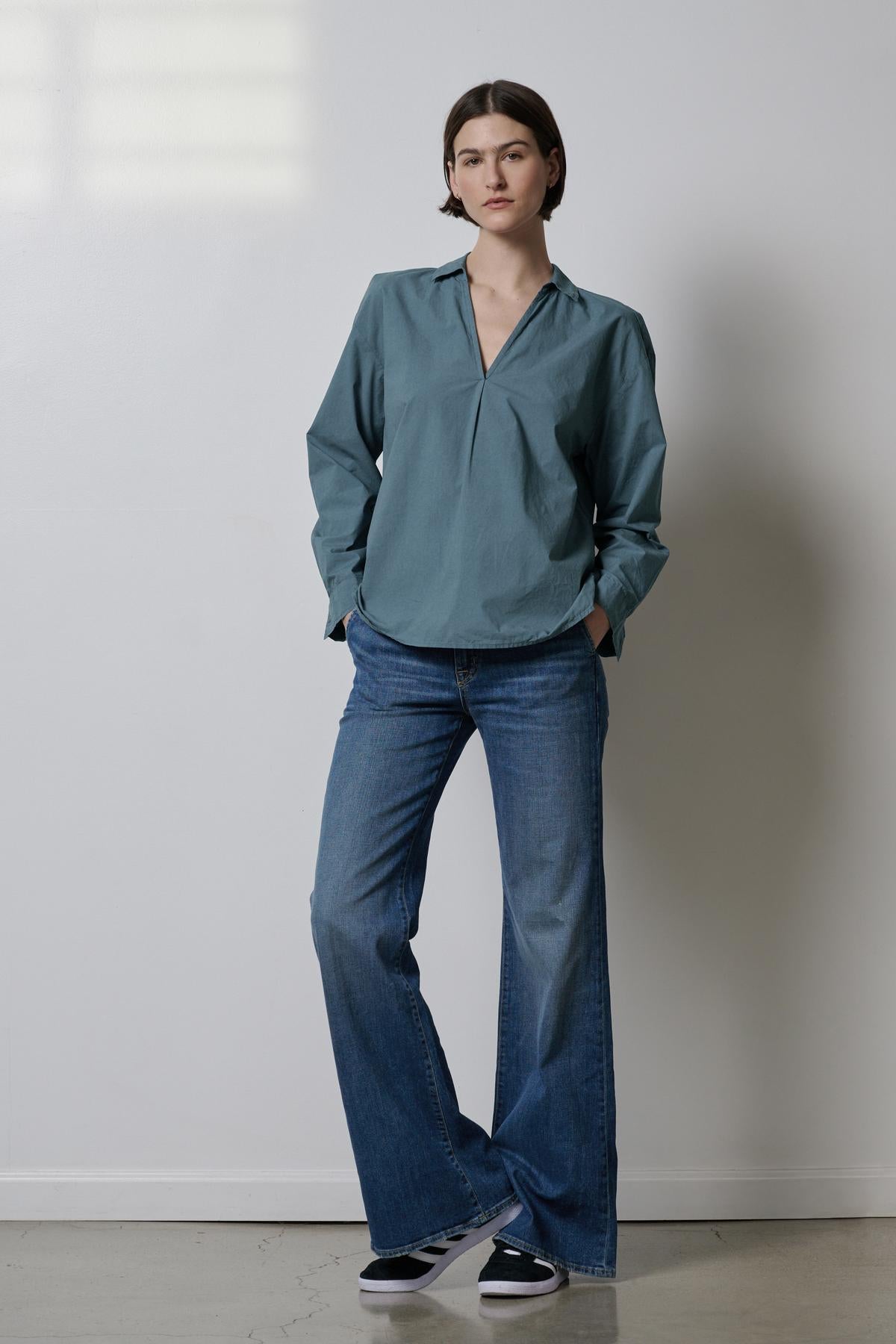 A woman wearing blue jeans and a Velvet by Jenny Graham BREA SHIRT full length-35190117597377