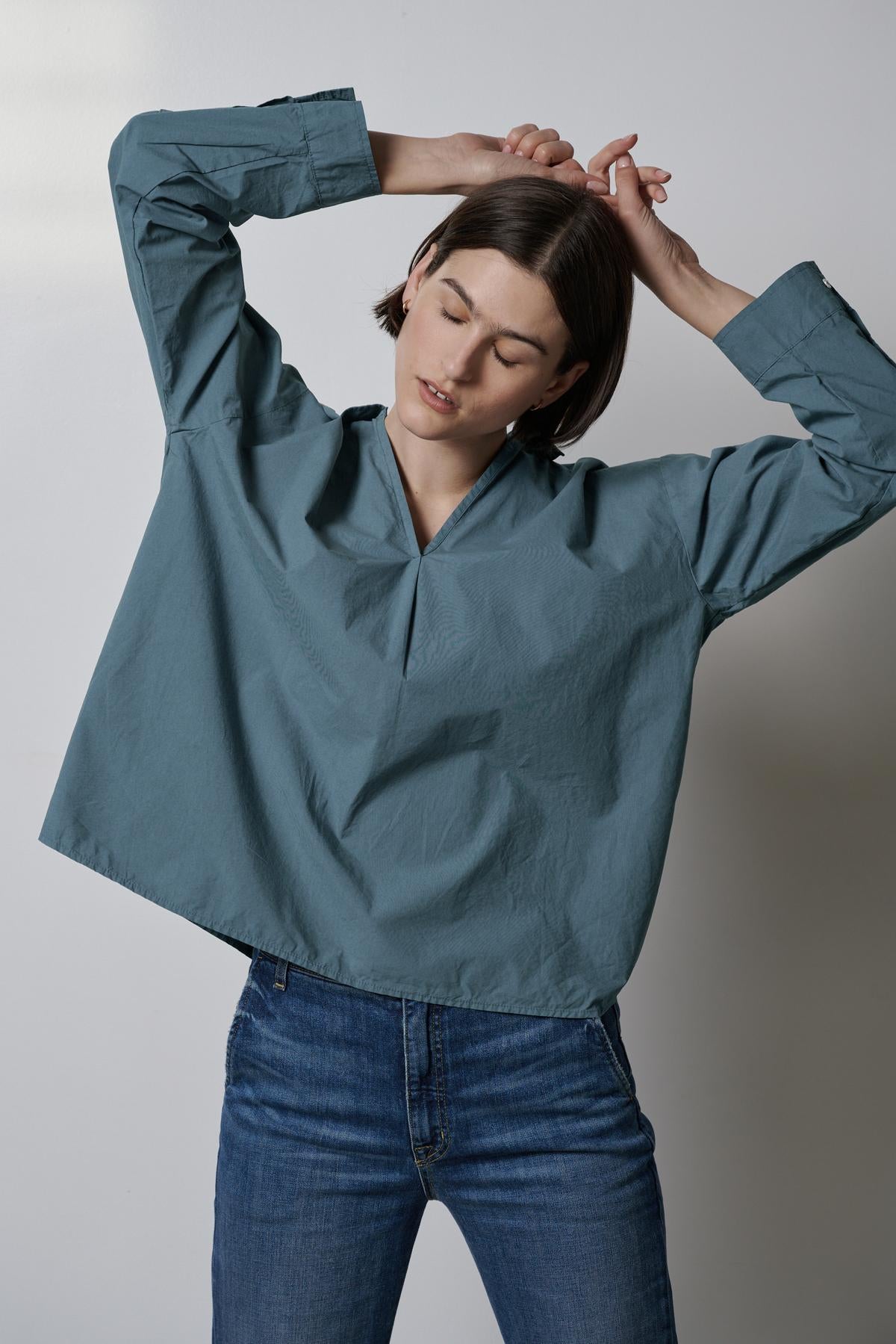 A woman wearing jeans and a Velvet by Jenny Graham BREA SHIRT.-35190117728449