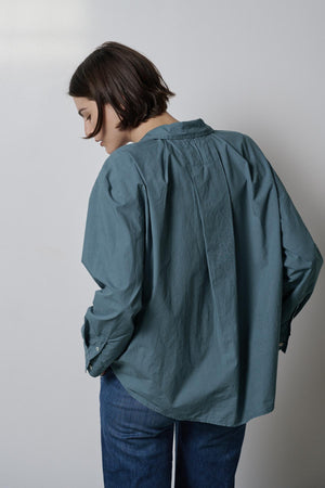 The back of a woman wearing jeans and a Velvet by Jenny Graham BREA SHIRT.