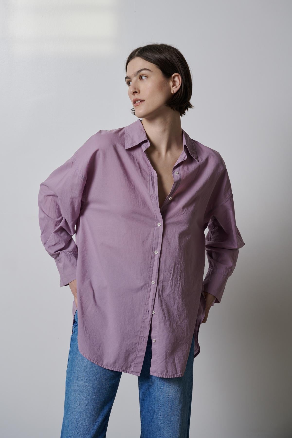 A woman wearing a Velvet by Jenny Graham REDONDO BUTTON-UP SHIRT and jeans.-35783066058945
