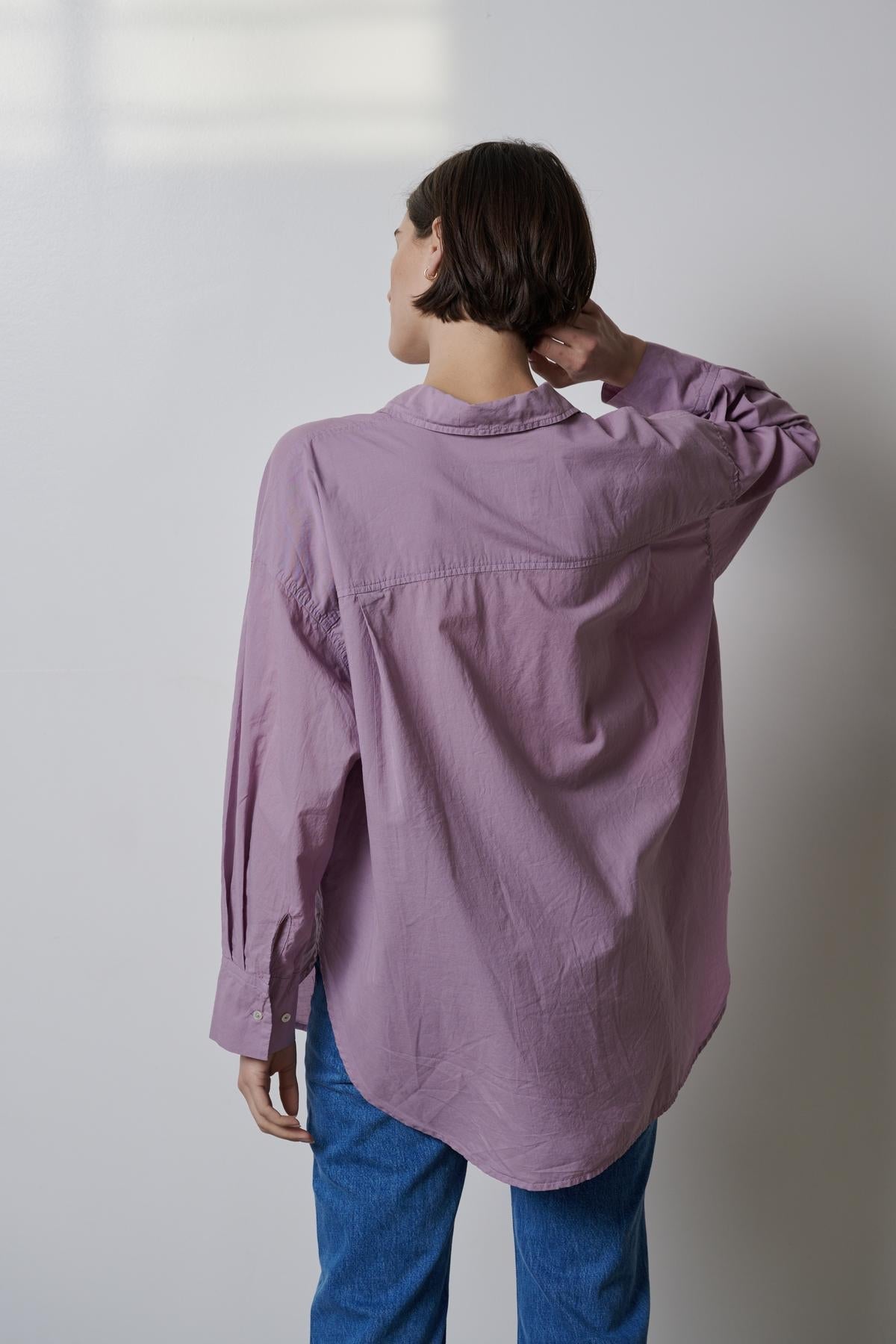 The back of a woman wearing the Velvet by Jenny Graham REDONDO BUTTON-UP SHIRT.-35783066157249