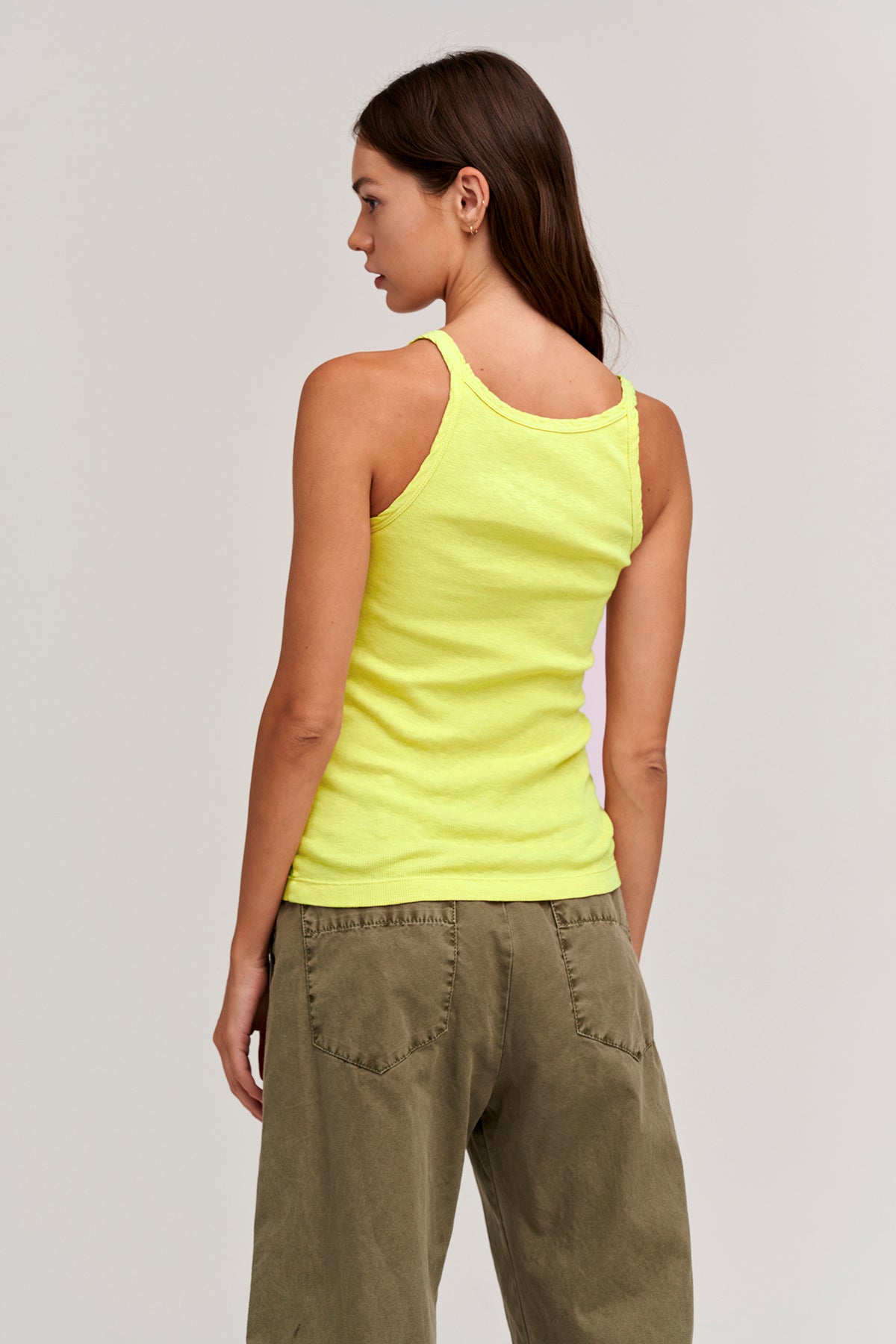 The back view of a woman wearing a Velvet by Graham & Spencer ALIZA RIBBED COTTON LAYERING TANK.-26629408030913