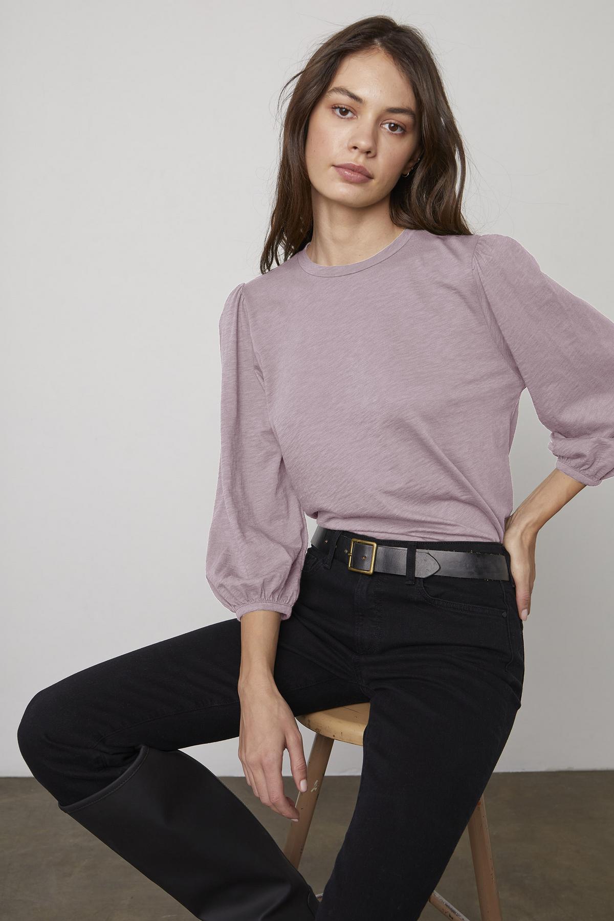   The model is wearing an ANETTE PUFF SLEEVE TEE in cotton slub knit from Velvet by Graham & Spencer. 
