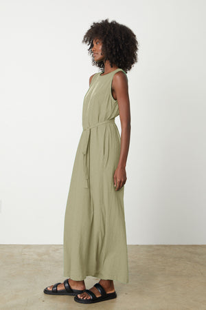 a woman wearing the EDITH SLEEVELESS MAXI DRESS by Velvet by Graham & Spencer.