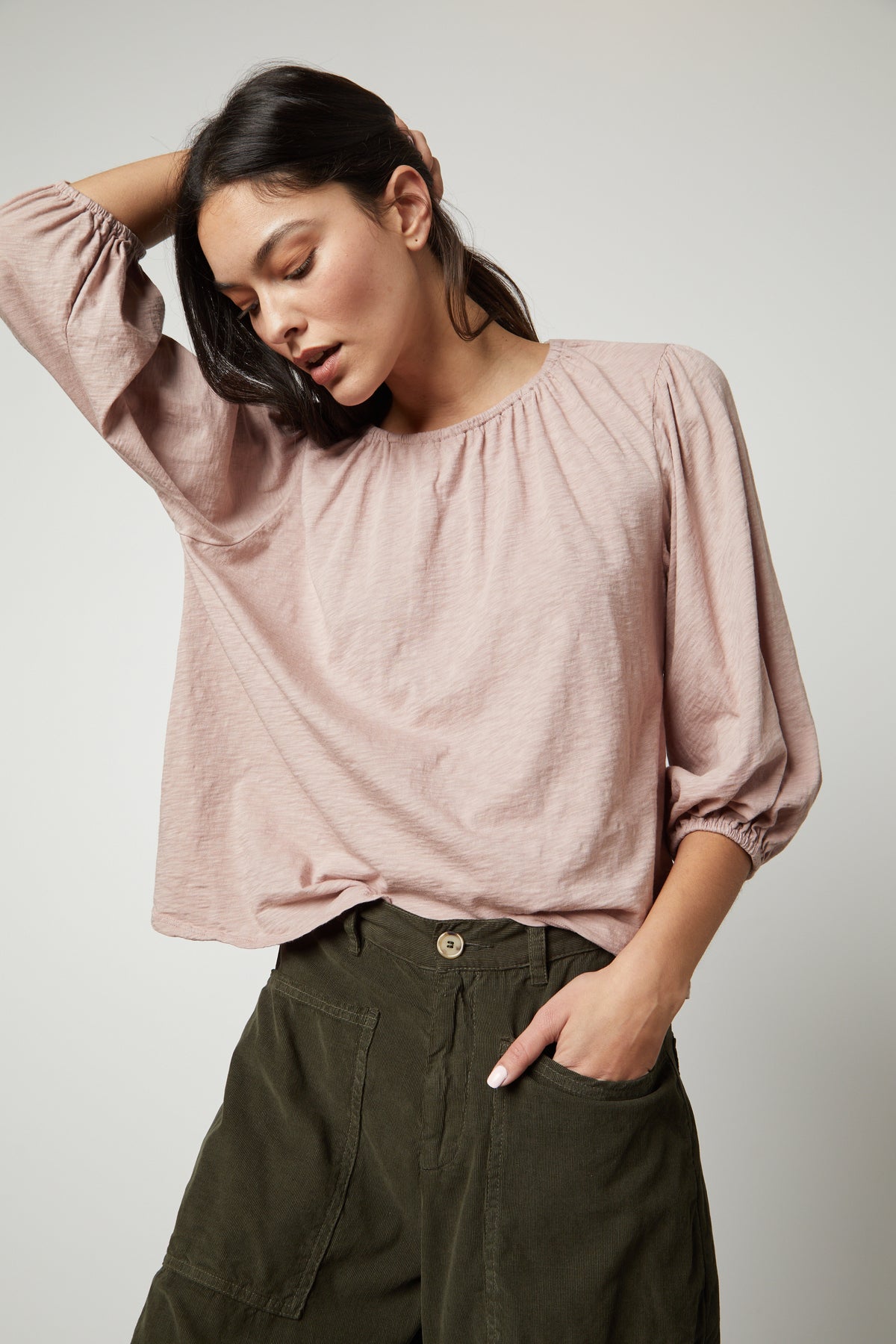 The model is wearing a Velvet by Graham & Spencer JULIE 3/4 SLEEVE TEE top and olive pants.-26727740309697