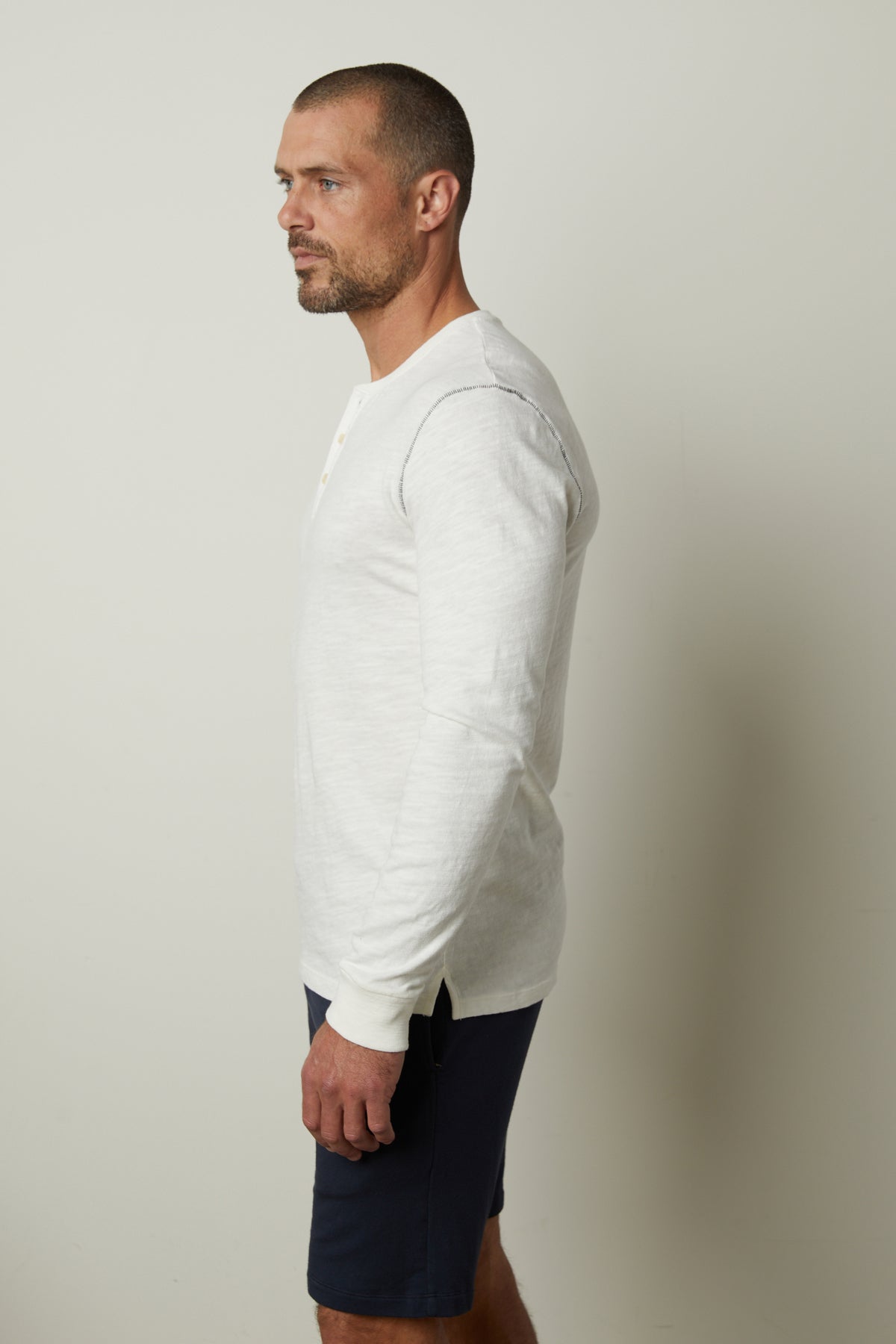A man wearing a Velvet by Graham & Spencer GABE HENLEY shirt with a vintage feel.-35662699430081
