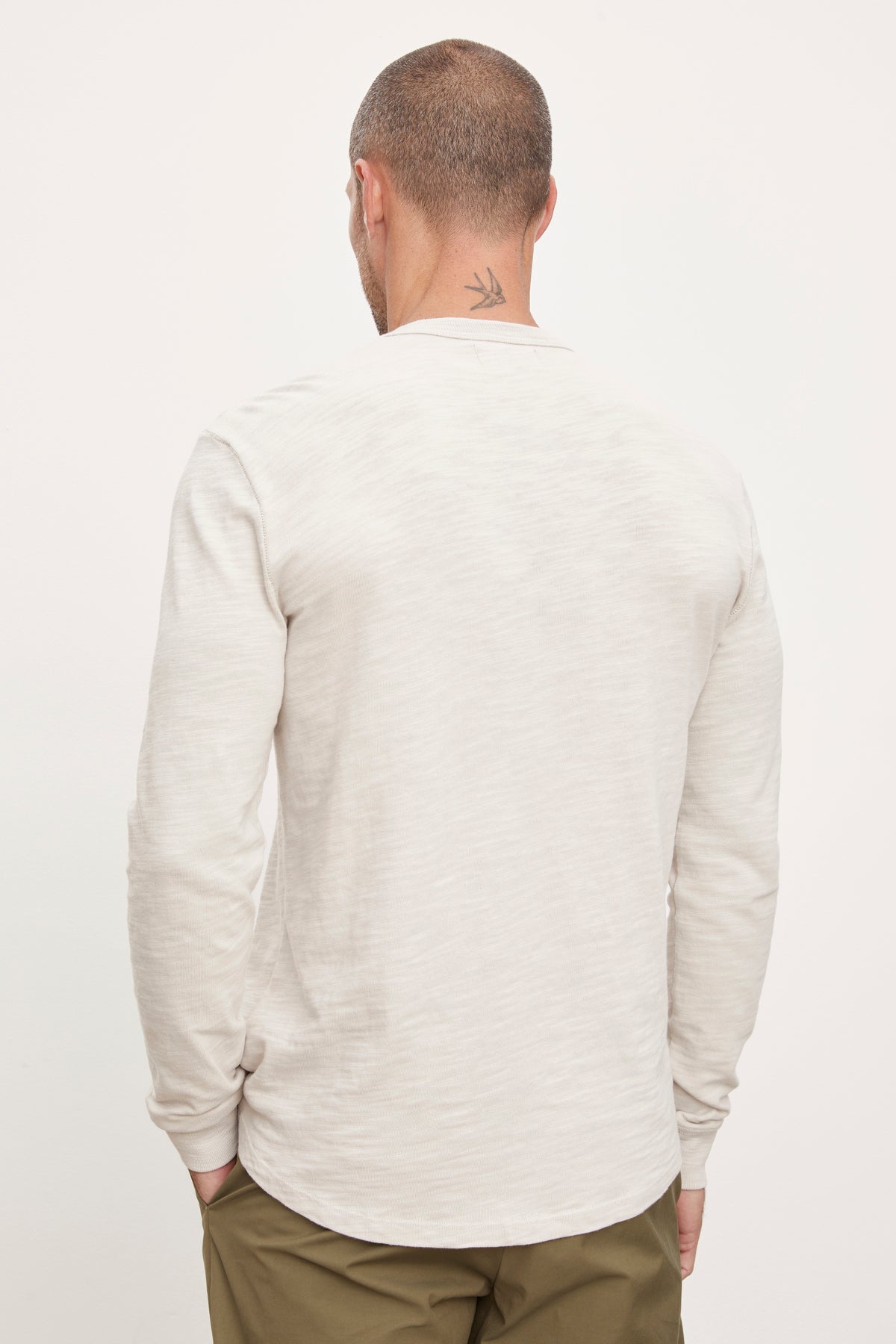   The back view of a man wearing a Velvet by Graham & Spencer PALMER CREW NECK TEE. 