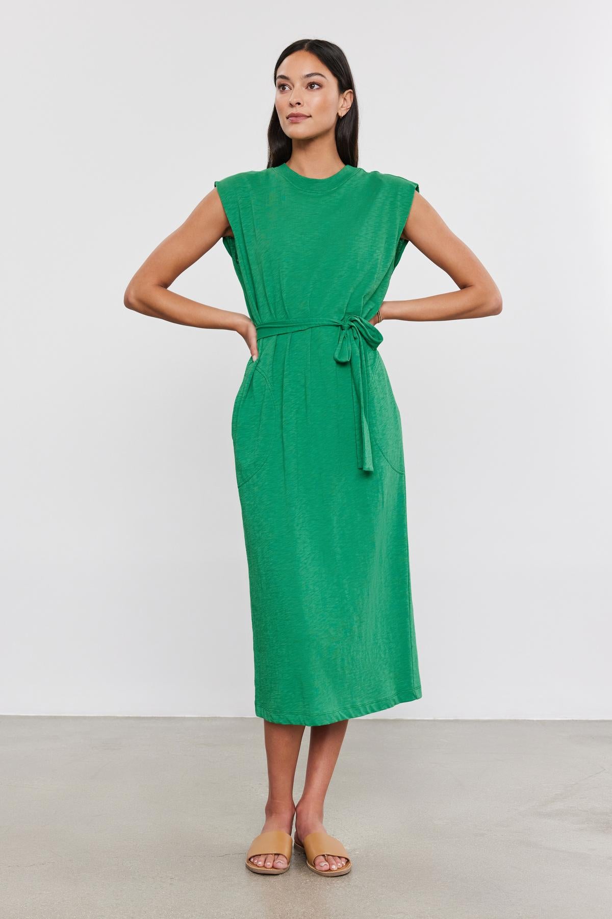   A woman in the LANE DRESS by Velvet by Graham & Spencer. 