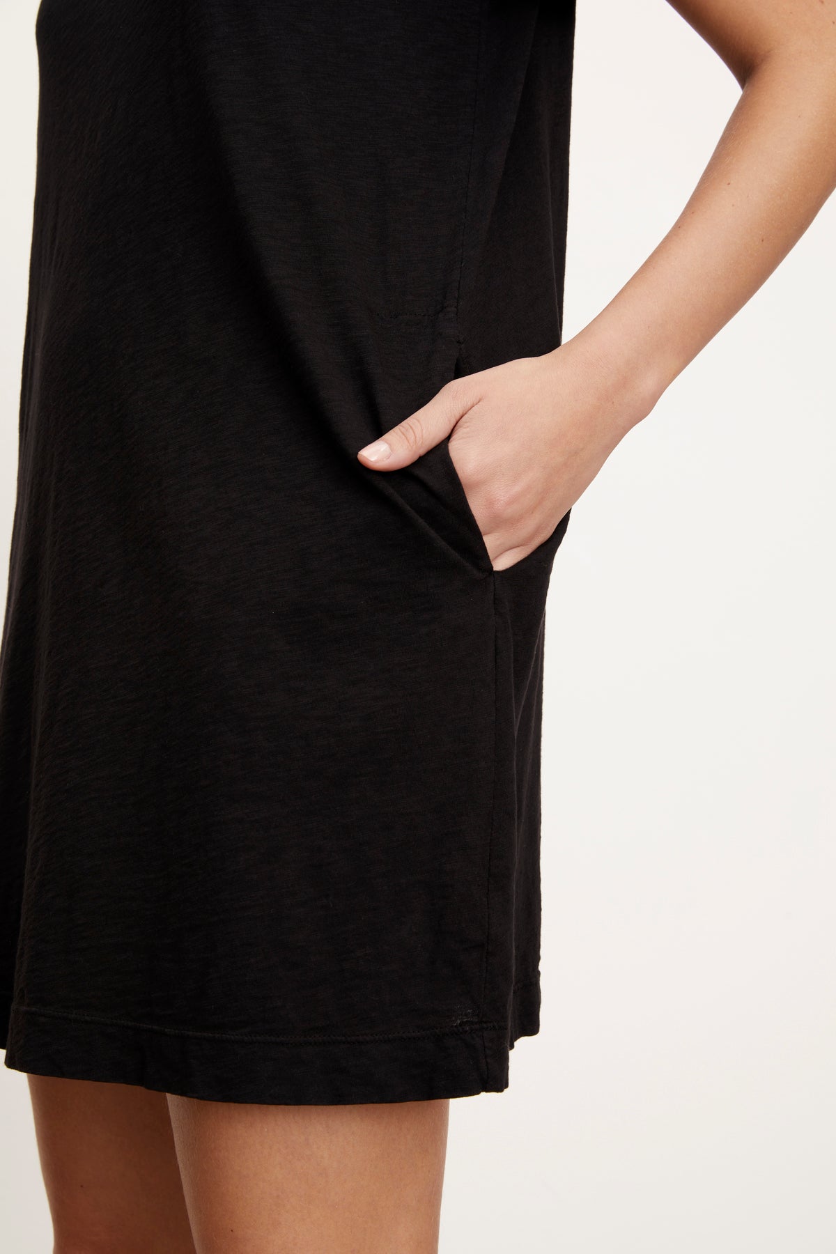   A woman wearing a LEIGH COTTON SLUB DRESS by Velvet by Graham & Spencer t-shirt dress. 