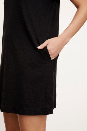 A woman wearing a LEIGH COTTON SLUB DRESS by Velvet by Graham & Spencer t-shirt dress.