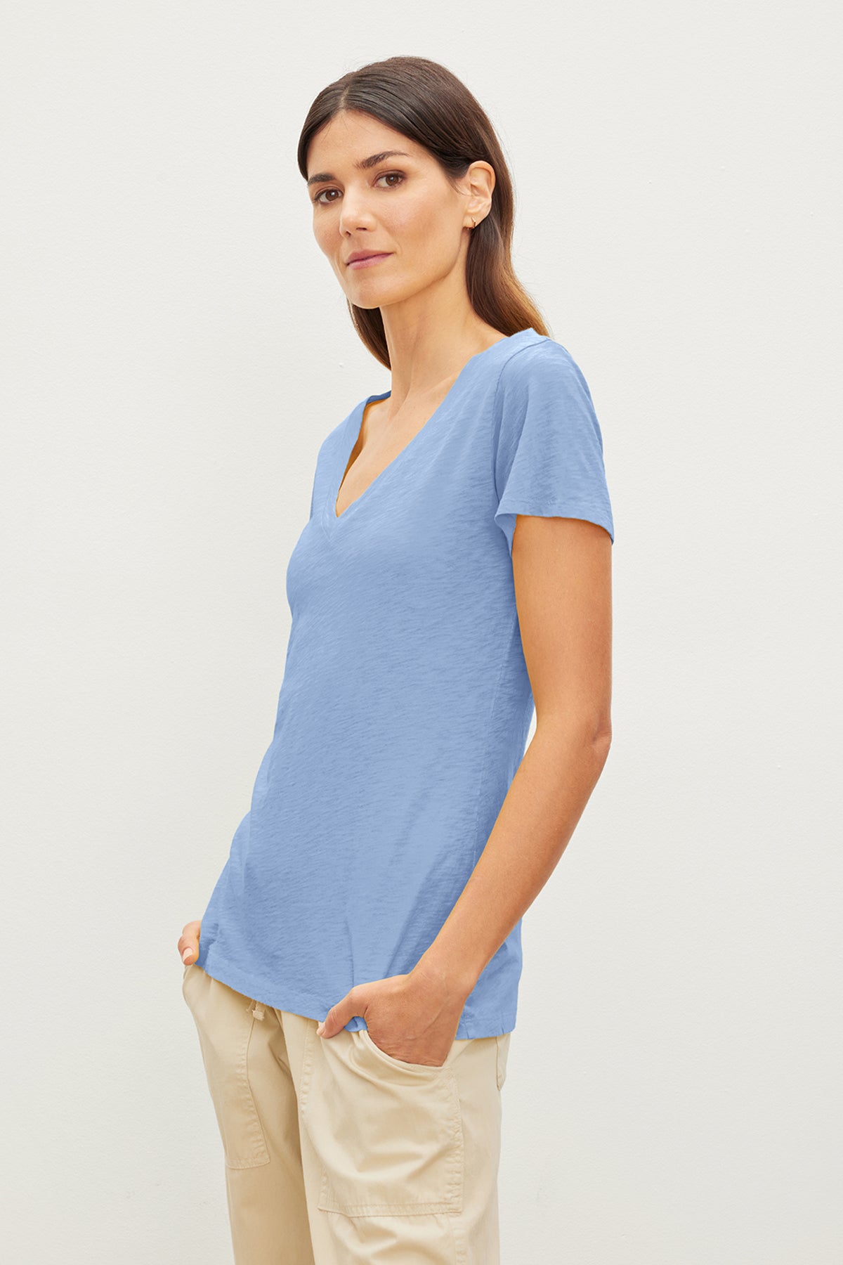   A preppy woman wearing a Velvet by Graham & Spencer LILITH COTTON SLUB V-NECK TEE. 