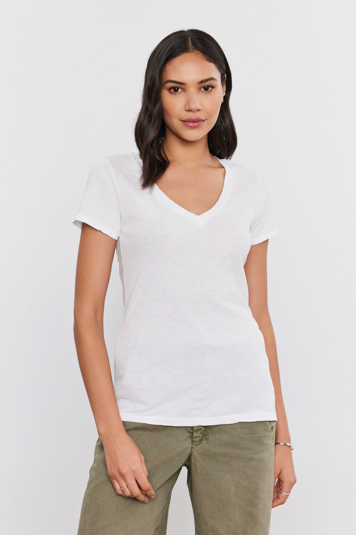 A woman wearing a Velvet by Graham & Spencer LILITH COTTON SLUB V-NECK TEE.-35586083422401